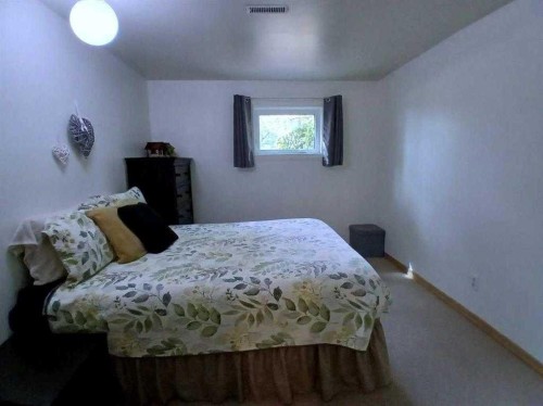 3808 49A Avenue, Innisfail, AB - Indoor Photo Showing Bedroom