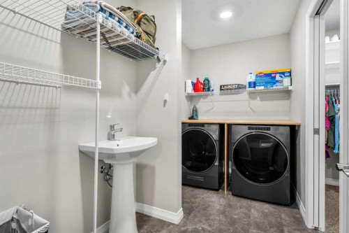 34 Seton Road Se, Calgary, AB - Indoor Photo Showing Laundry Room