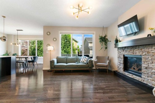 434 River Heights Drive, Cochrane, AB - Indoor Photo Showing Living Room With Fireplace