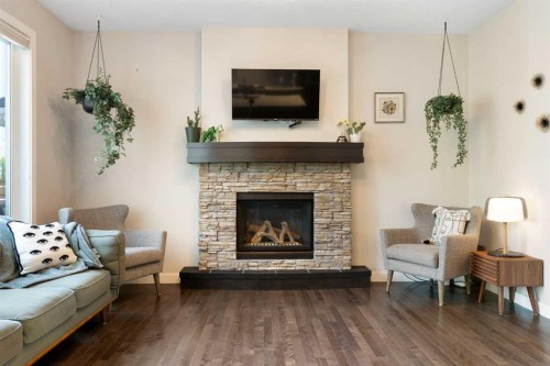 434 River Heights Drive, Cochrane, AB - Indoor Photo Showing Living Room With Fireplace