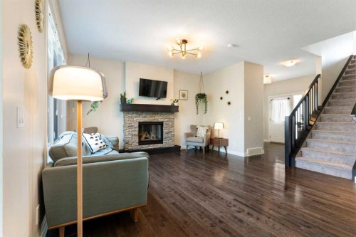 434 River Heights Drive, Cochrane, AB - Indoor Photo Showing Living Room With Fireplace