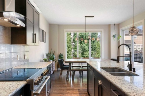 434 River Heights Drive, Cochrane, AB - Indoor Photo Showing Kitchen With Double Sink With Upgraded Kitchen