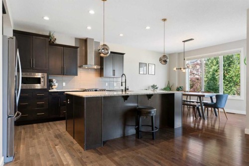434 River Heights Drive, Cochrane, AB - Indoor Photo Showing Kitchen With Upgraded Kitchen
