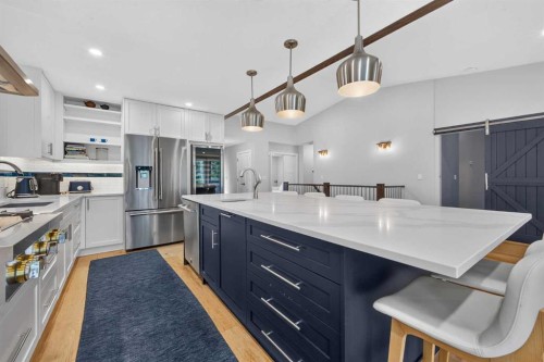 12 Sunset Way, Priddis Greens, AB - Indoor Photo Showing Kitchen With Stainless Steel Kitchen With Upgraded Kitchen