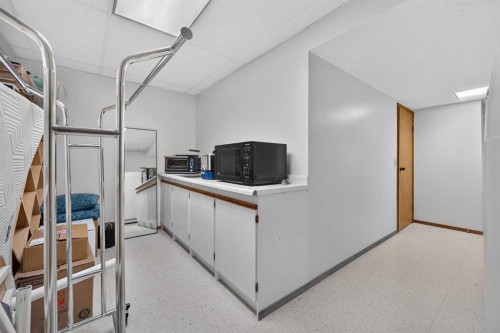 12 Sunset Way, Priddis Greens, AB - Indoor Photo Showing Other Room