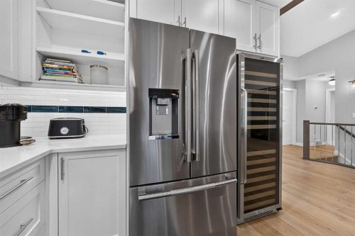 12 Sunset Way, Priddis Greens, AB - Indoor Photo Showing Kitchen With Stainless Steel Kitchen