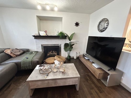 86 Covepark Road, Calgary, AB - Indoor Photo Showing Living Room With Fireplace
