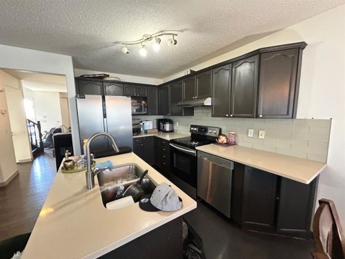 86 Covepark Road, Calgary, AB - Indoor Photo Showing Kitchen With Stainless Steel Kitchen With Double Sink
