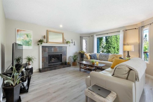 151 Citadel Close Nw, Calgary, AB - Indoor Photo Showing Living Room With Fireplace