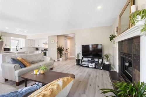151 Citadel Close Nw, Calgary, AB - Indoor Photo Showing Living Room With Fireplace