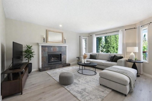 151 Citadel Close Nw, Calgary, AB - Indoor Photo Showing Living Room With Fireplace
