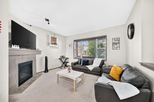 251 Skyview Point Road Ne, Calgary, AB - Indoor Photo Showing Living Room With Fireplace