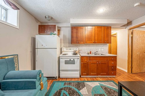 35 Martin Crossing Park Ne, Calgary, AB - Indoor Photo Showing Kitchen With Double Sink