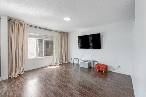 35 Martin Crossing Park Ne, Calgary, AB - Indoor Photo Showing Living Room