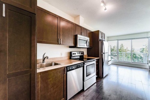 511-30 Brentwood Common Nw, Calgary, AB - Indoor Photo Showing Kitchen With Stainless Steel Kitchen