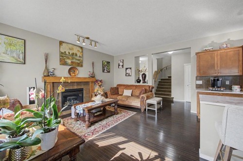 1600 Copperfield Boulevard Se, Calgary, AB - Indoor Photo Showing Living Room With Fireplace