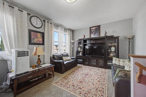 1600 Copperfield Boulevard Se, Calgary, AB - Indoor Photo Showing Living Room