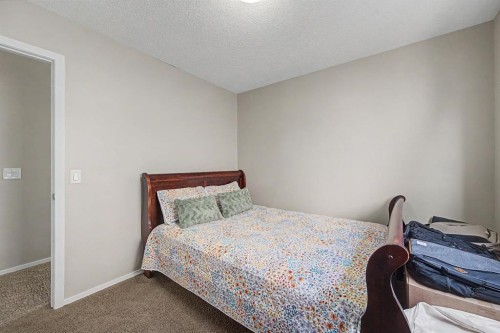 1600 Copperfield Boulevard Se, Calgary, AB - Indoor Photo Showing Bedroom