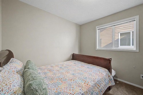 1600 Copperfield Boulevard Se, Calgary, AB - Indoor Photo Showing Bedroom