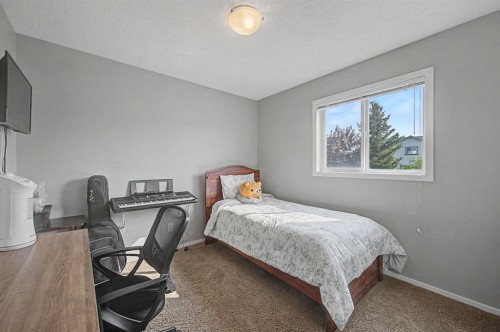 1600 Copperfield Boulevard Se, Calgary, AB - Indoor Photo Showing Bedroom