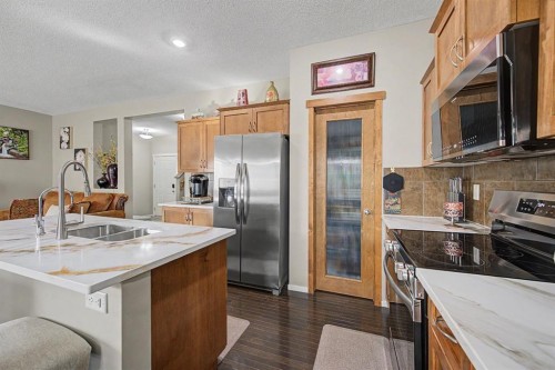 1600 Copperfield Boulevard Se, Calgary, AB - Indoor Photo Showing Kitchen With Stainless Steel Kitchen With Double Sink With Upgraded Kitchen