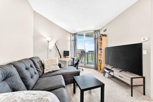 5601-11811 Lake Fraser Drive Se, Calgary, AB - Indoor Photo Showing Living Room