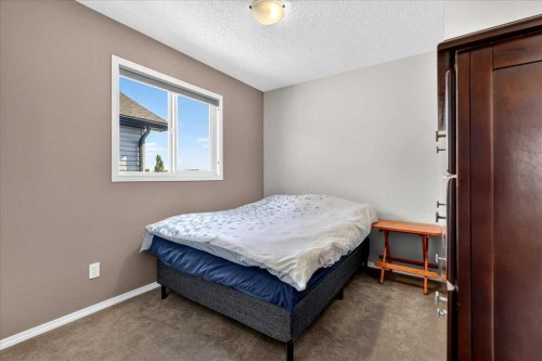 21 Mcintyre Place Nw, Langdon, AB - Indoor Photo Showing Bedroom