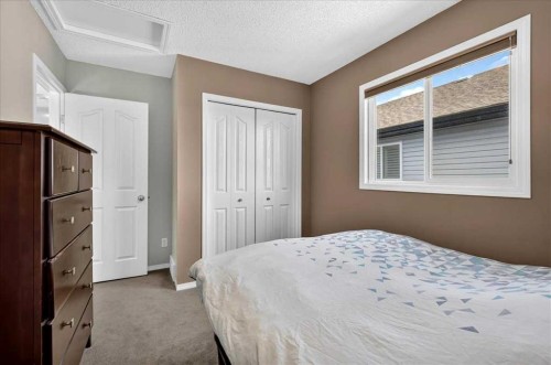 21 Mcintyre Place Nw, Langdon, AB - Indoor Photo Showing Bedroom
