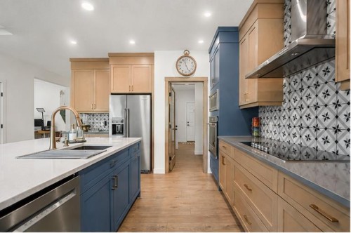 52 Cranbrook Cape Se, Calgary, AB - Indoor Photo Showing Kitchen With Upgraded Kitchen