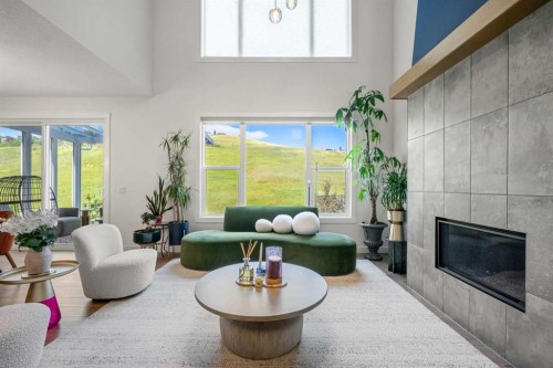 52 Cranbrook Cape Se, Calgary, AB - Indoor Photo Showing Living Room With Fireplace