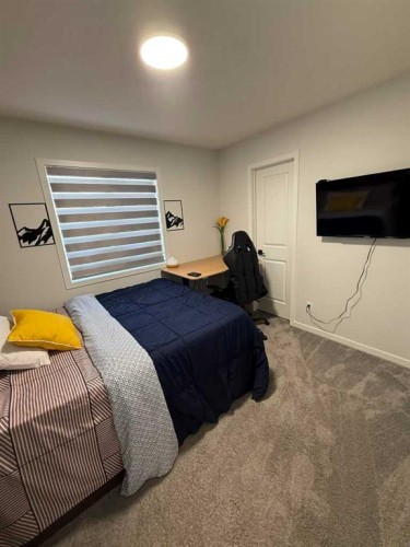41 Edith Gate Nw, Calgary, AB - Indoor Photo Showing Bedroom