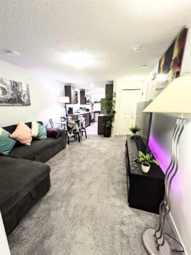 41 Edith Gate Nw, Calgary, AB - Indoor Photo Showing Living Room