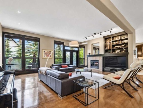 10 Aspen Ridge Way Sw, Calgary, AB - Indoor Photo Showing Living Room With Fireplace