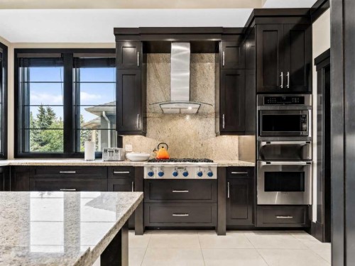 10 Aspen Ridge Way Sw, Calgary, AB - Indoor Photo Showing Kitchen With Upgraded Kitchen