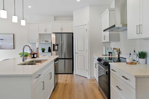 541 Ranch Green, Strathmore, AB - Indoor Photo Showing Kitchen With Double Sink With Upgraded Kitchen