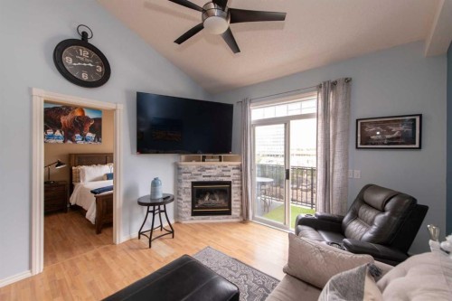 235-112 14 Avenue Se, Calgary, AB - Indoor Photo Showing Living Room With Fireplace