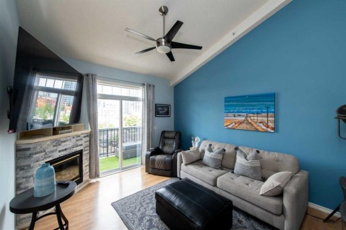 235-112 14 Avenue Se, Calgary, AB - Indoor Photo Showing Living Room With Fireplace