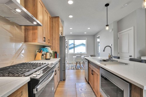 152 Belmont Way Sw, Calgary, AB - Indoor Photo Showing Kitchen With Upgraded Kitchen
