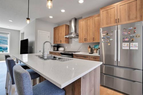 152 Belmont Way Sw, Calgary, AB - Indoor Photo Showing Kitchen With Double Sink With Upgraded Kitchen