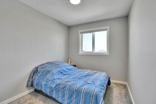 152 Belmont Way Sw, Calgary, AB - Indoor Photo Showing Bedroom