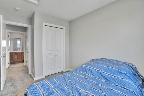 152 Belmont Way Sw, Calgary, AB - Indoor Photo Showing Bedroom