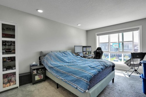 152 Belmont Way Sw, Calgary, AB - Indoor Photo Showing Bedroom