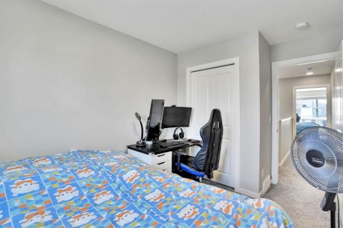 152 Belmont Way Sw, Calgary, AB - Indoor Photo Showing Bedroom