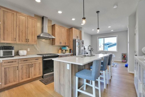 152 Belmont Way Sw, Calgary, AB - Indoor Photo Showing Kitchen With Upgraded Kitchen