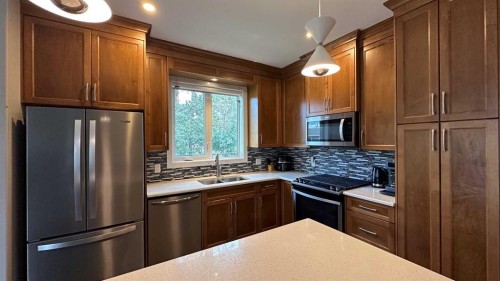 9-610 4 Avenue Sw, Sundre, AB - Indoor Photo Showing Kitchen With Double Sink