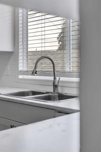 27 Dovercrest Way Se, Calgary, AB - Indoor Photo Showing Kitchen With Double Sink