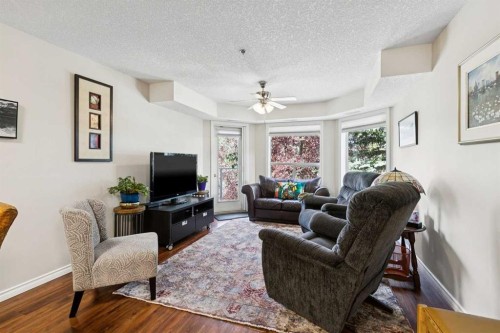 3238-1818 Simcoe Boulevard Sw, Calgary, AB - Indoor Photo Showing Living Room