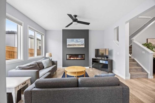 338 Magnolia Way Se, Calgary, AB - Indoor Photo Showing Living Room With Fireplace