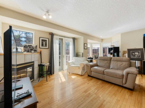 81 Prominence View Sw, Calgary, AB - Indoor Photo Showing Living Room With Fireplace