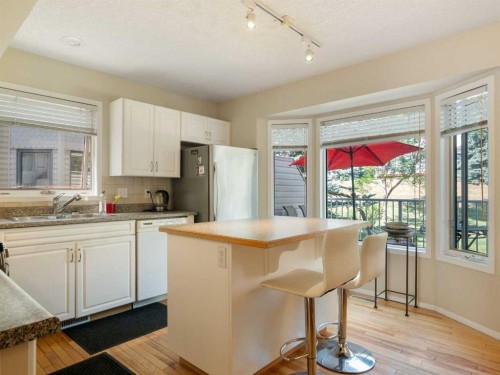 81 Prominence View Sw, Calgary, AB - Indoor Photo Showing Kitchen With Double Sink